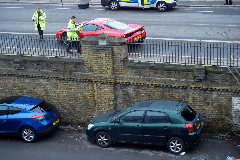  The scene in London where a pedestrian was hit by a Ferrari and thrown over a railing on to the dark green Toyota