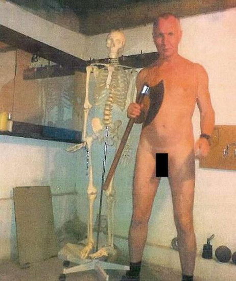  Convicted German cannibal Detlev Guenzel posed naked - except for a pair of socks - brandishing an axe