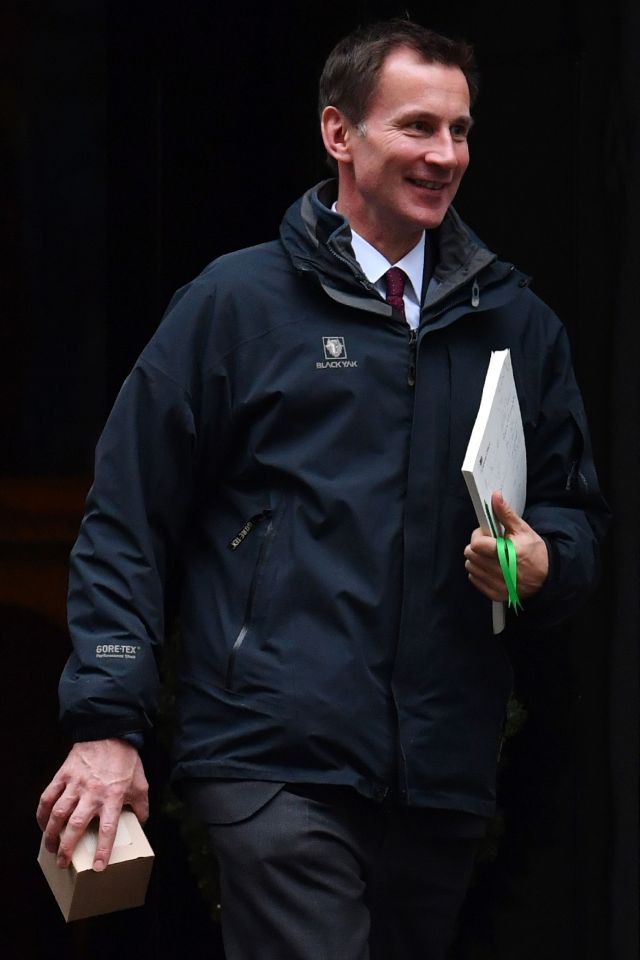  Health Secretary Jeremy Hunt clutches his mug as he leaves Downing Street this morning