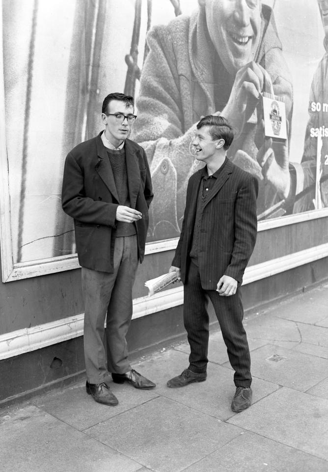  Two male pals share a joke on the streets of Kentish Town in 1955. The images form part of a new exhibition in Oxford