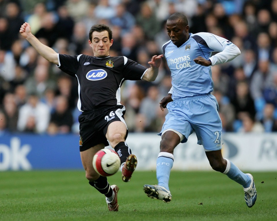  Trabelsi in action for Manchester City against Wigan in 2007