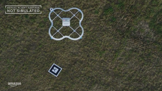  The parcel sits in the middle of the drone as it flies - this picture shows the first successful delivery by drone as it flies from the base to the customer