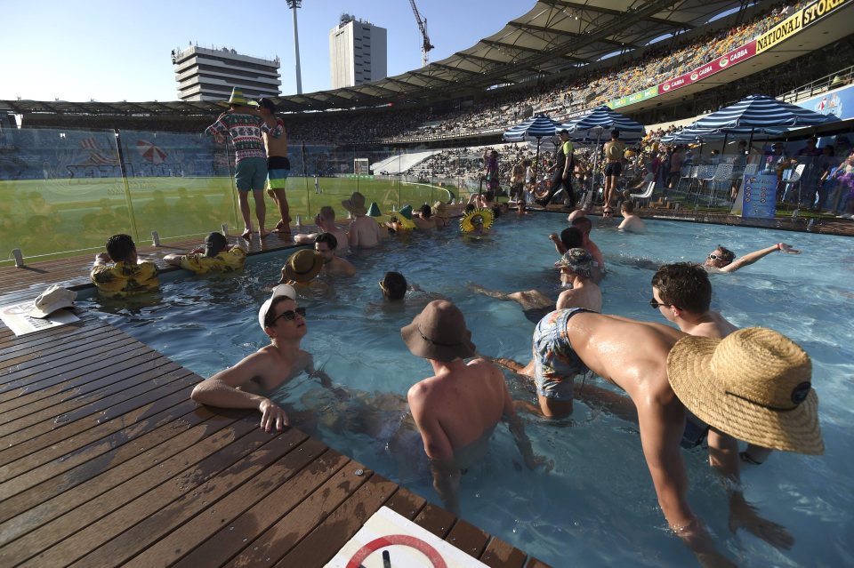  Cricket fans watch the game from the pool deck