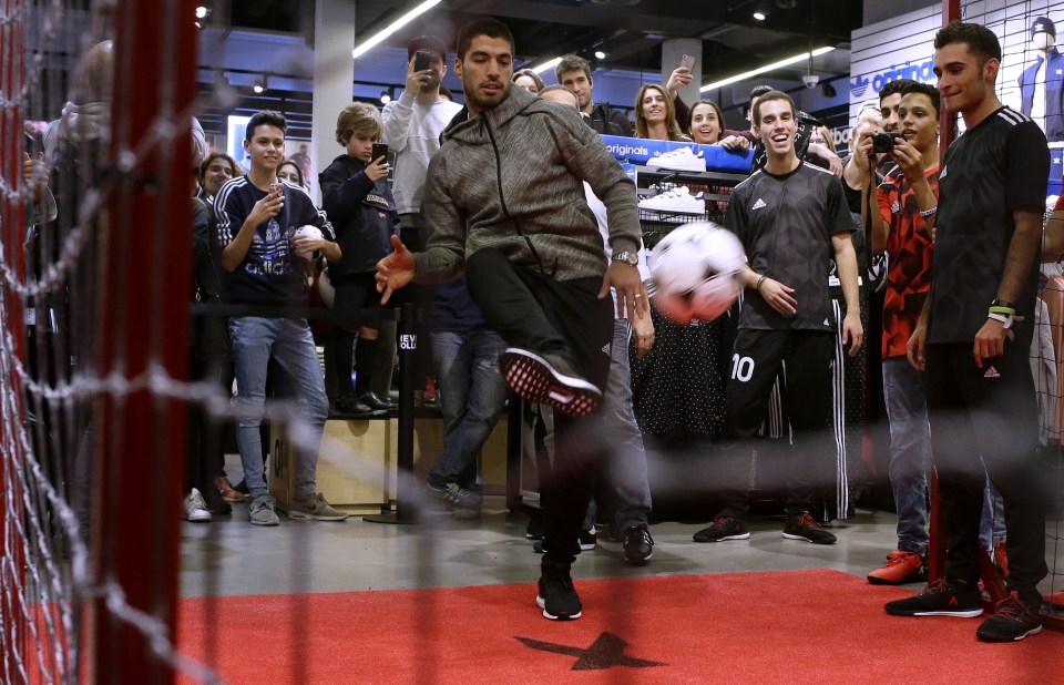  Suarez at a promotional event in Barcelona on Thursday after signing his new deal