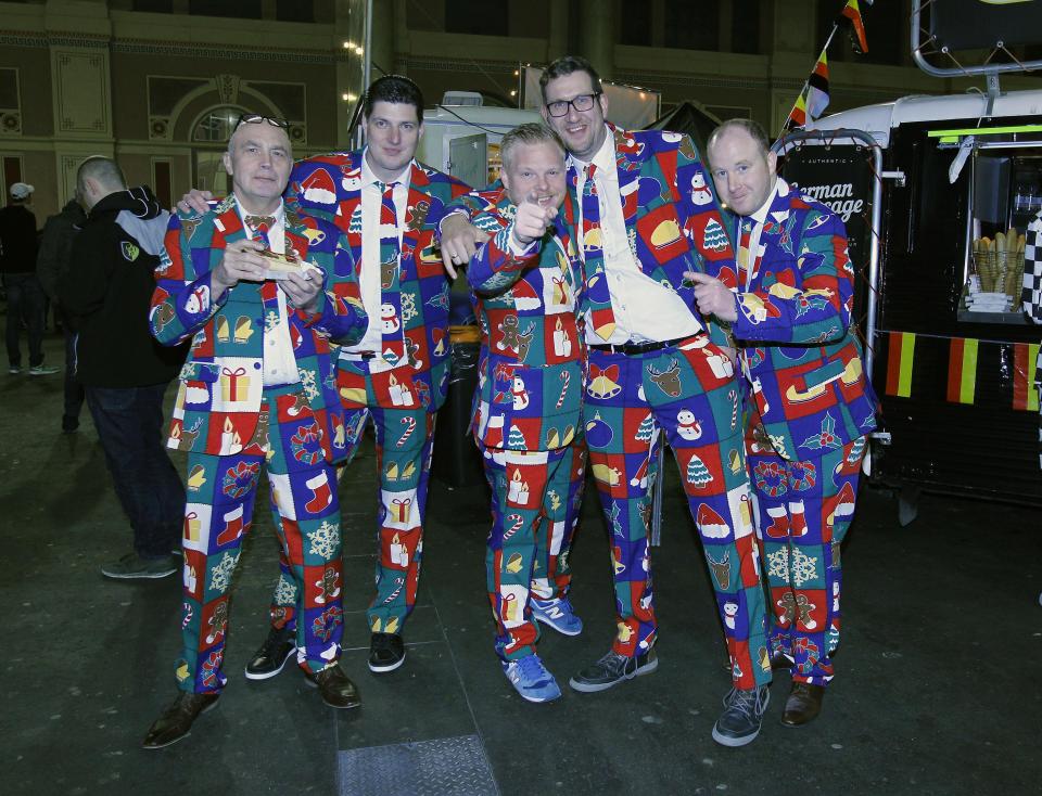 A group of darts supporters come dressed in Christmas outfits