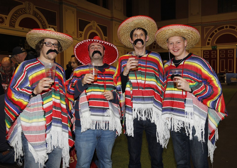 A group of spectators come complete with sombreros for the opening night of the tournament