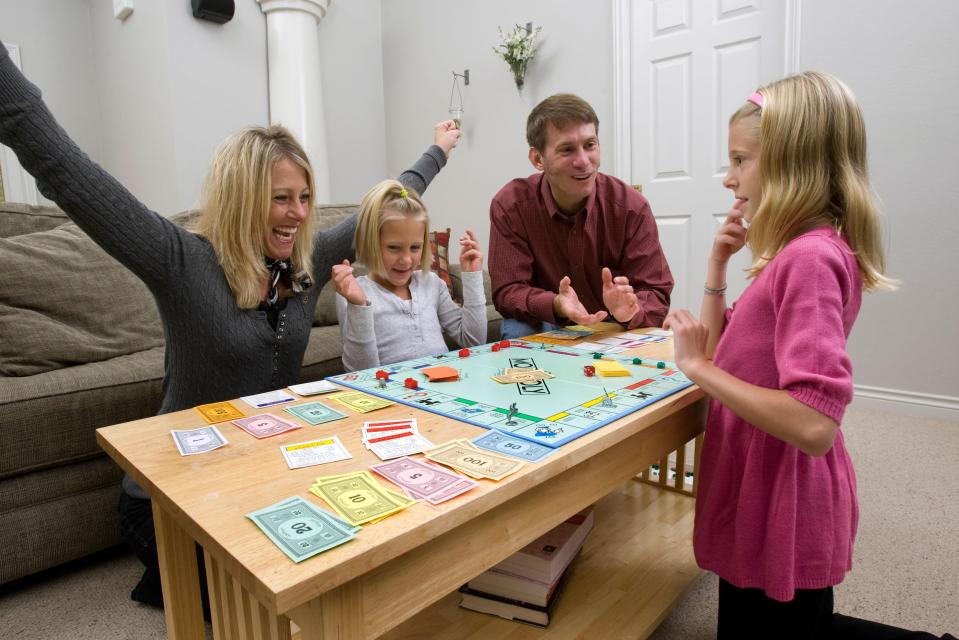  A familiar sight in homes at Christmas time - someone gloating over the Monopoly board