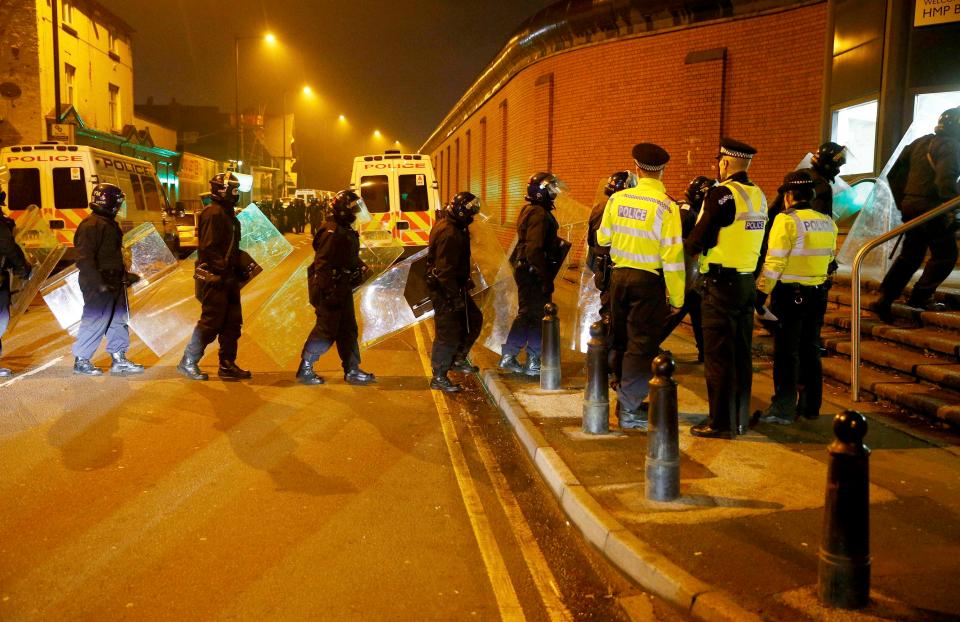  Guards line up to storm the prison after violence erupted