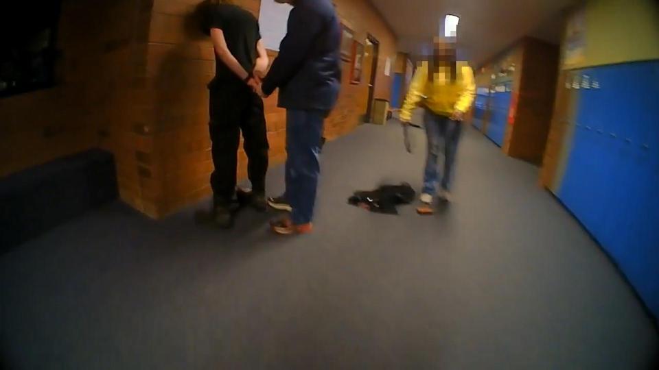  The video captures the teens father disarming him after he allegedly fire a shotgun at the ceiling of a classroom