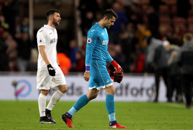 The Swansea players trudge off the pitch after a damaging defeat to Middlesbrough