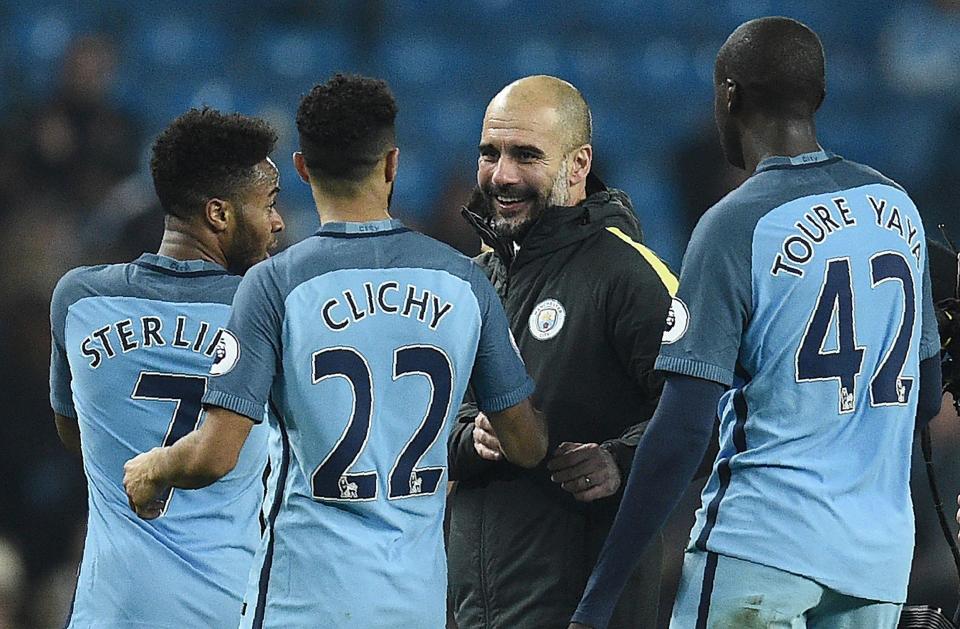  Pep Guardiola congratulates his players after their victory