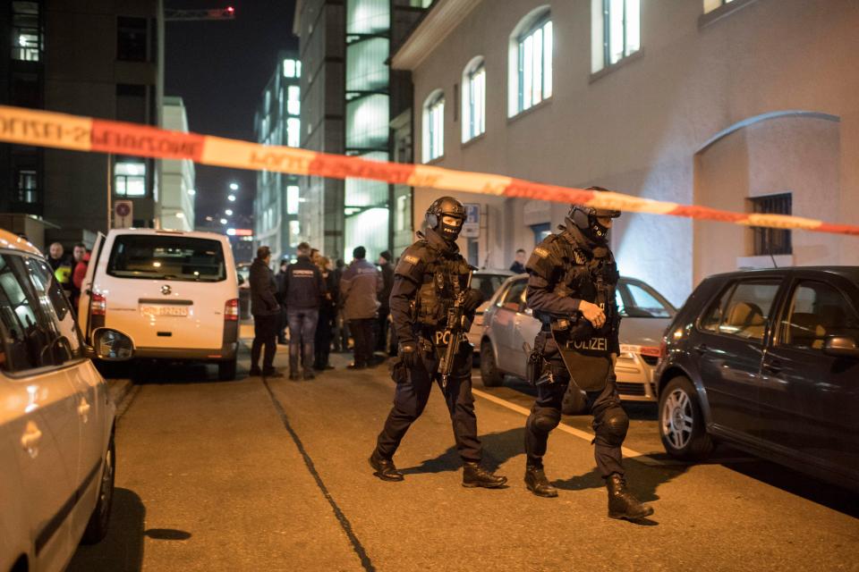  Swiss police officers are seen searching the area near a Muslim prayer hall, central Zurich