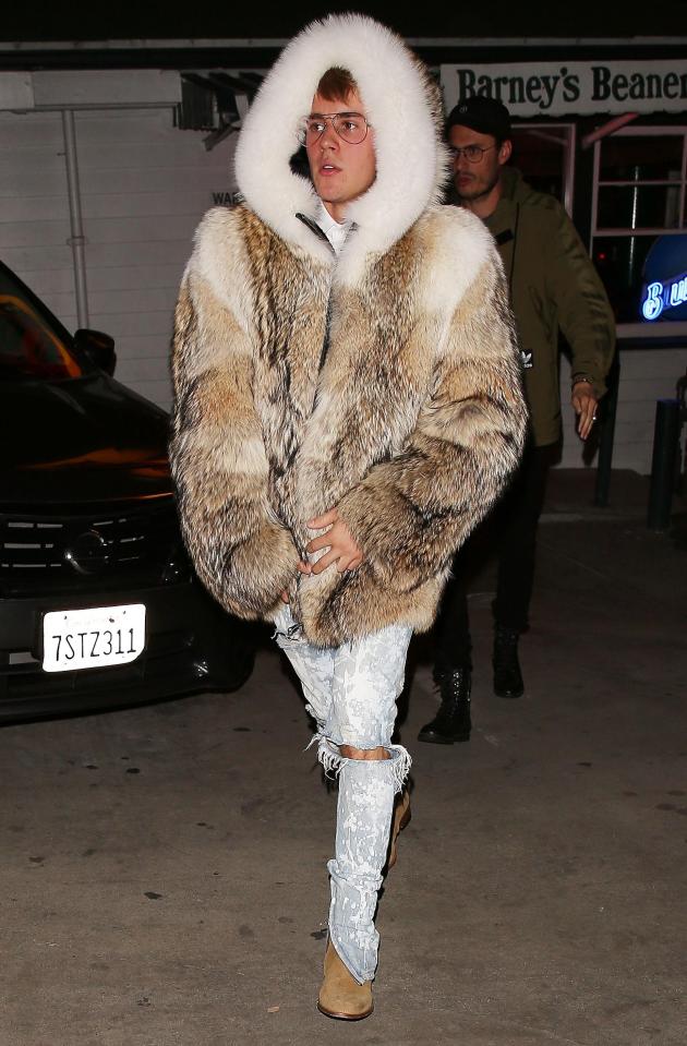  Justin wore a large fur coat for his night at a small diner in California