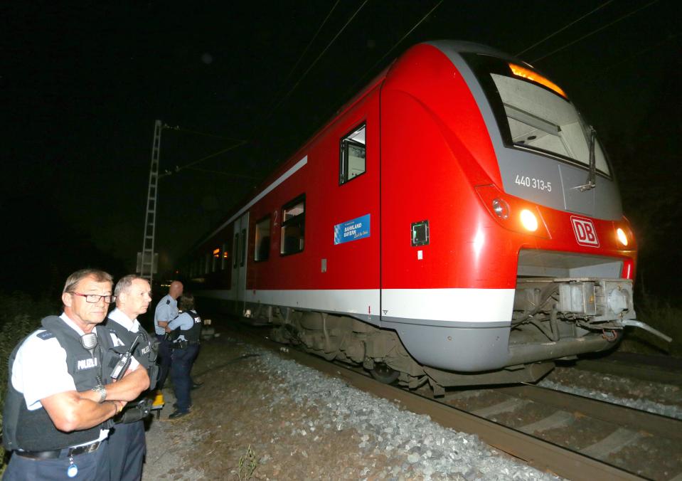  Police stand guard overnight outside the train. They eventually shot Riyad dead as he attempted to flee the scene