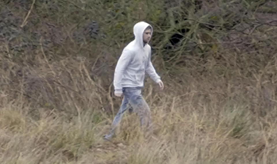  A hooded man was seen near Palmer's house before the shooting