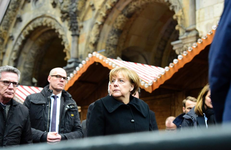  Merkel, pictured at the scene of the Berlin attack, is facing a backlash within her own party