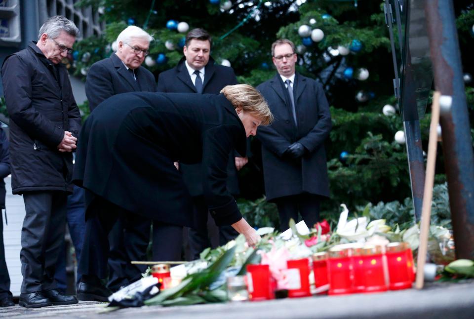  The German leader lays flowers at the scene of the truck massacre