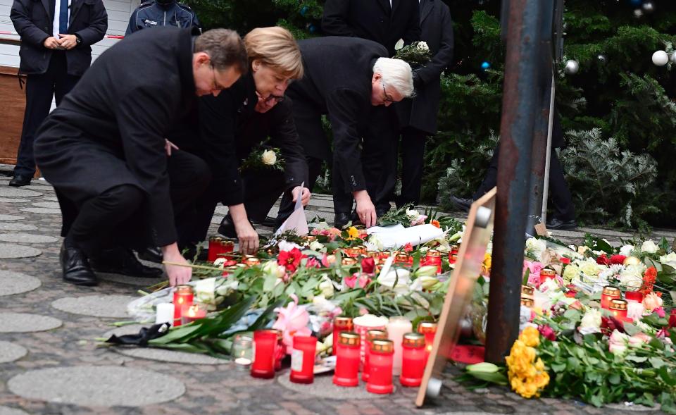  Angela Merkel and Berlin mayor Michael Mueller pay tributes