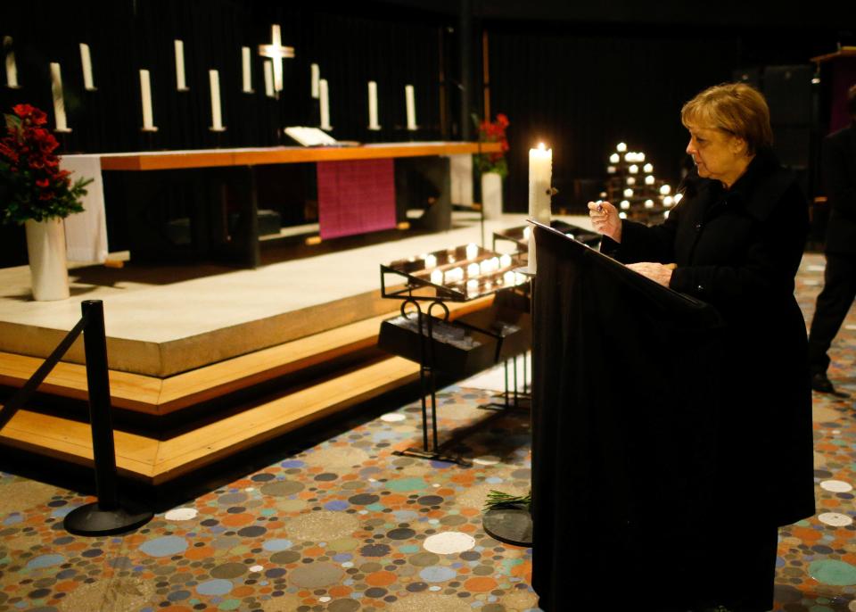  Mrs Merkel at service in church next to the market