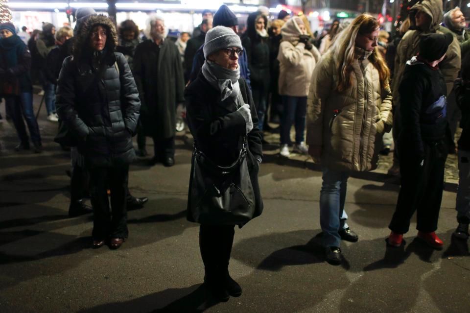  Pensive Berliners try an absorb the tragedy that has unfurled