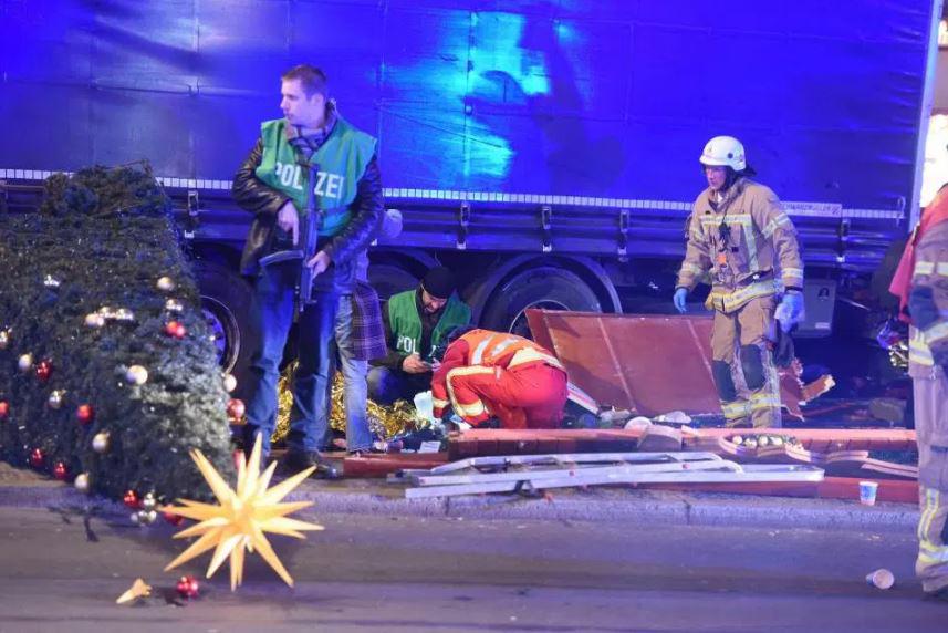  A paramedic treats a casualty at the scene of the horror