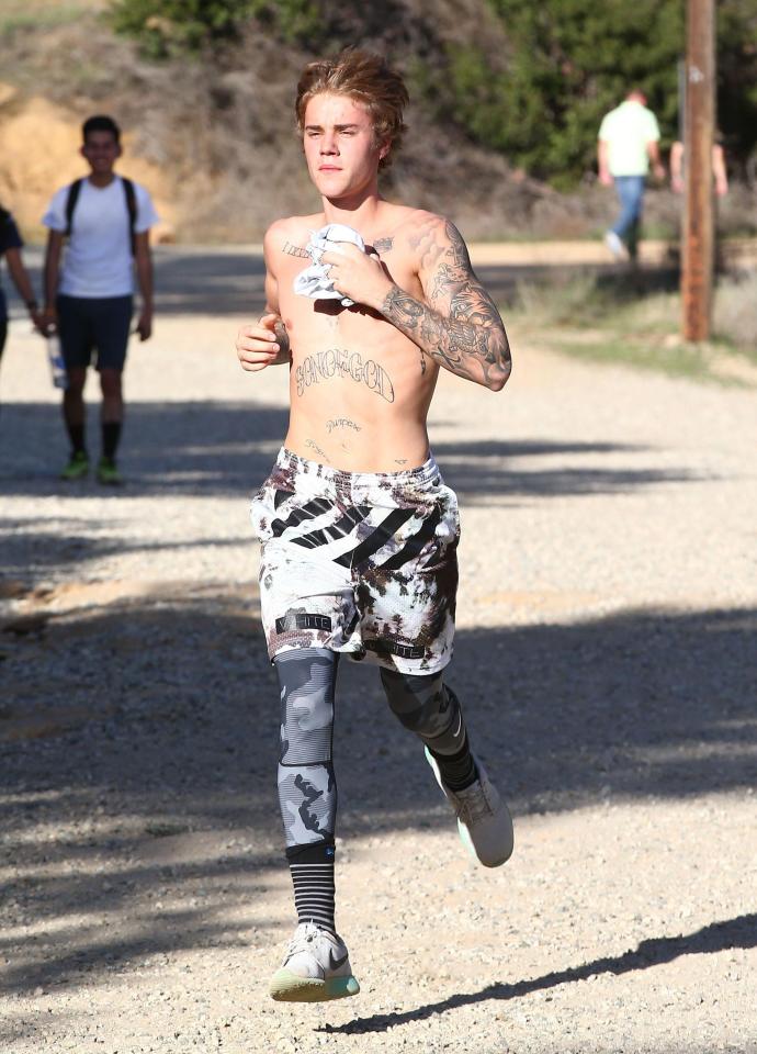  Justin wore a pair of Nike running leggings underneath his board shorts