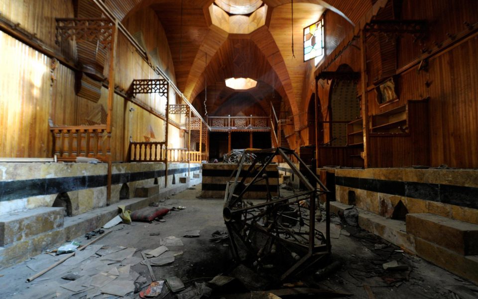 Damage to the mosque which dates back to the 13th century, with tables strewn over the floor and debris everywhere