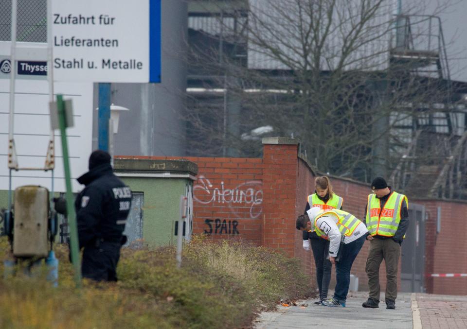  Berlin police were today pictured hunting for clues about the suspect who carried out Monday night's terror attack