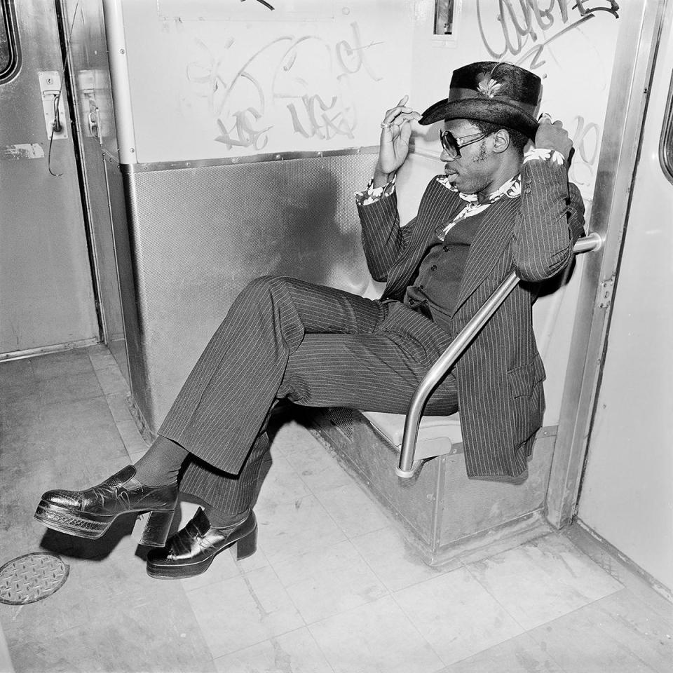  This dapper chap hitches a ride on the subway