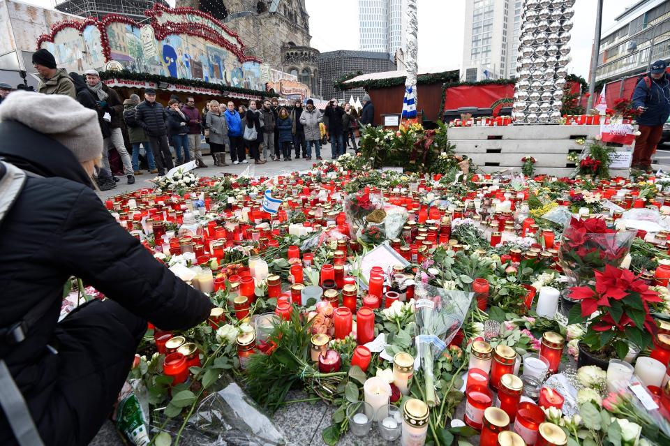  A mass of candles and floral tributes placed at the recently re-opened Christmas Market