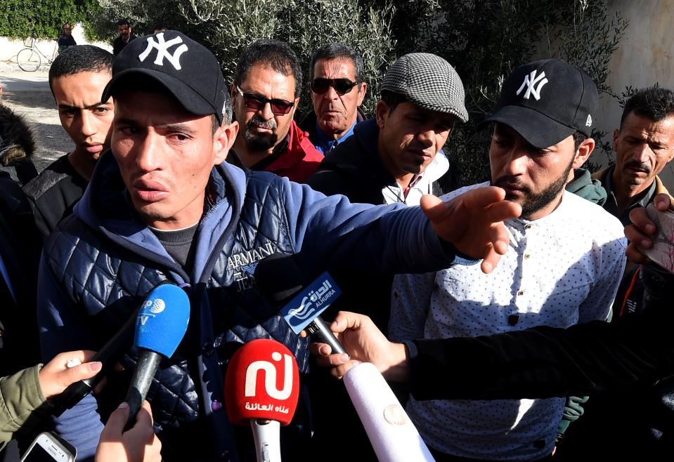  Brothers Walid (L) and Abdelkader (2nd R) Amri speak to reporters about their sibling - who is suspected of carrying out the Berlin massacre