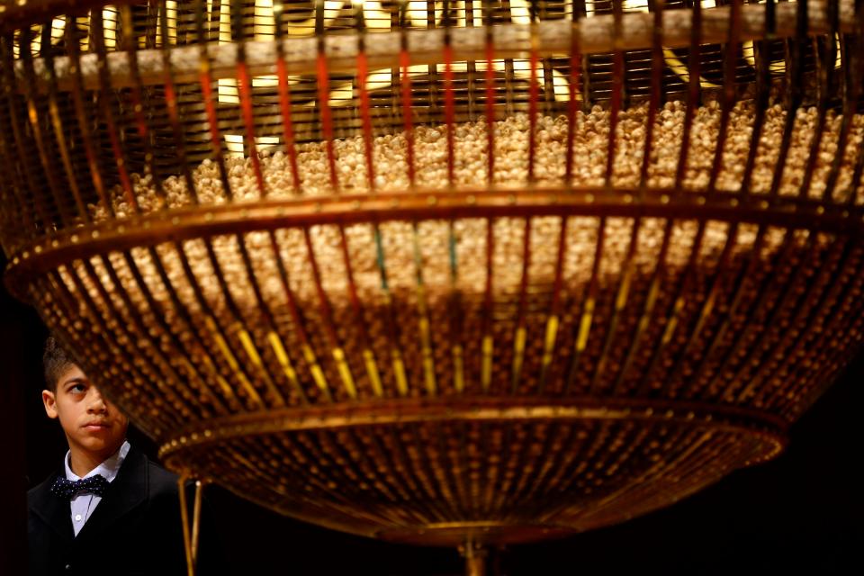  A giant drum filled with balls bearing ticket numbers for Spain's Christmas lottery draw in Madrid