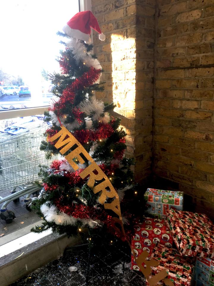  The festive feature had a Christmas tree and presents against a brick wall