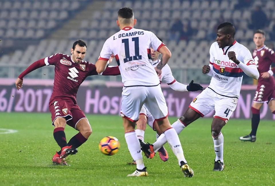  Torino's defender Davide Zappacosta vies for the ball with Genoa's midfielder Isaac Cofie