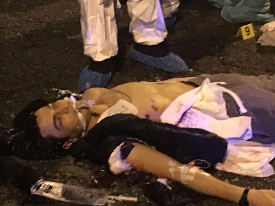  Amri lay dead in the street after being gunned down by rookie cop Luca Scata