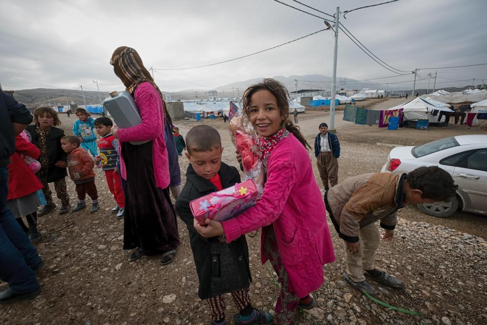  Kids who have escaped from fighting in mosul Iraq in the Zelikan refugee camp recieve toys from The Sun