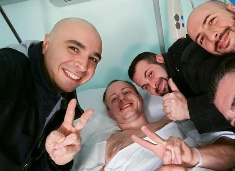  Christian Movio (centre) is recovering in hospital after being shot in the shoulder by Amri following a routine ID check