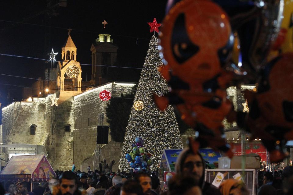  The square was filled with Christmas lights and a giant tree