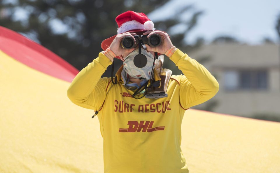  A festive Bondi lifeguard keeps keeps a watchful eye on the revellers