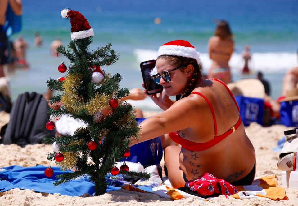  One sunbather brought her own Christmas tree to the sandy shores