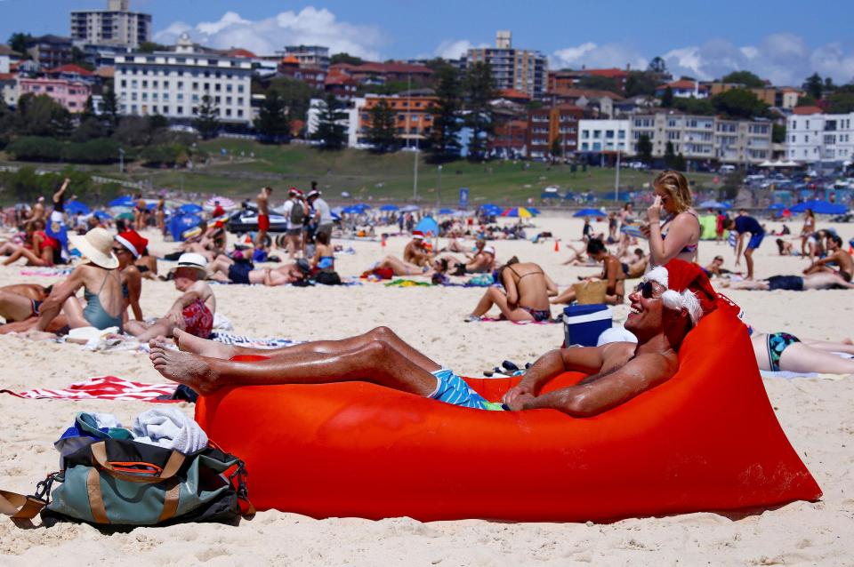  This reveller bakes on a beanbag in the 27C December heat