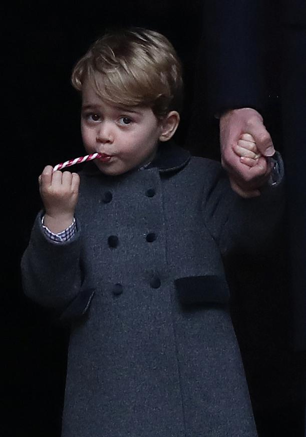  Prince George . . . youngster was seen with a festive treat in his mouth after service