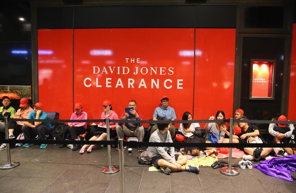  Dedicated bargain hunters camp out on the pavement as they wait for the doors to open