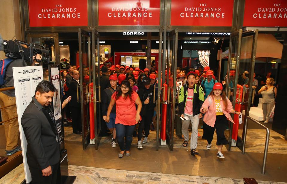  Ultra-keen shoppers rush the doors as the store opens