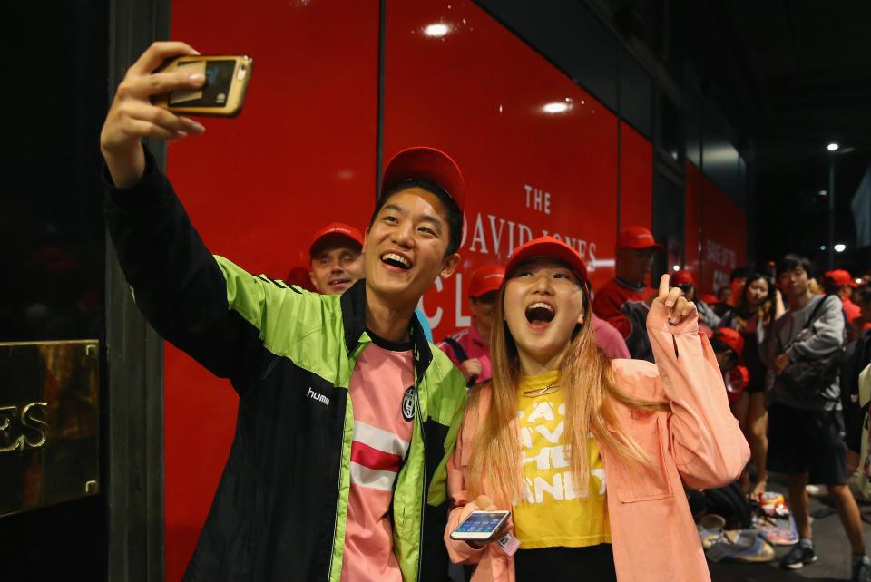  A pair of shoppers take a selfie as they wait for the Sydney department store to open