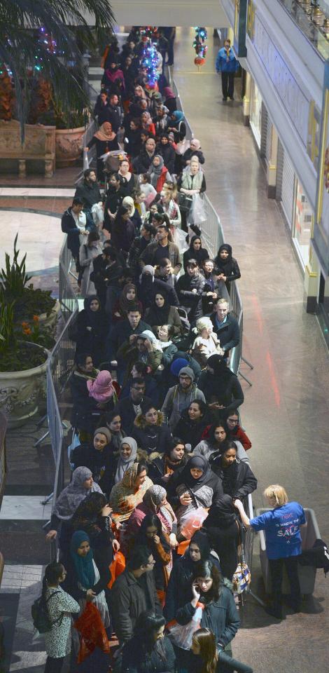  Shoppers queue at the Intu Trafford Centre in Manchester in a bid to grab a bargain