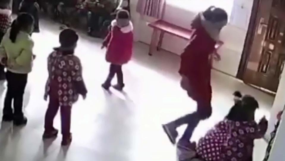  The teacher is seen sticking the boot in on one girl