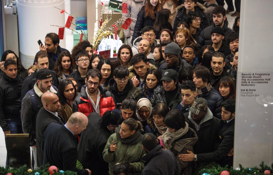  Hundreds of shoppers are squeezed towards an escalator at Selfridges earlier today