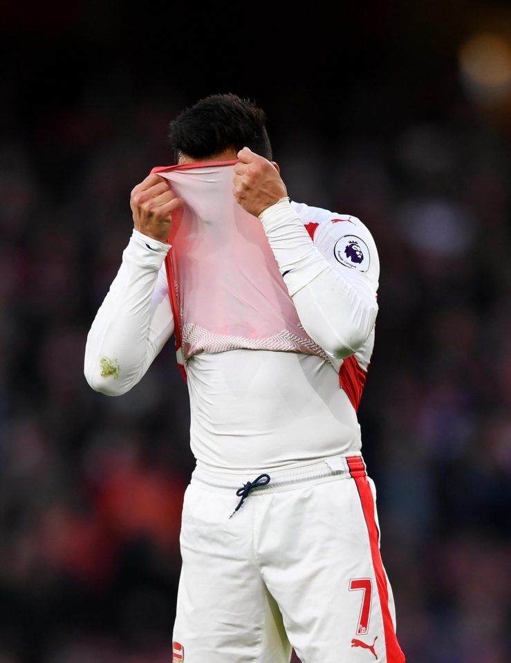  Alexis Sanchez cuts a frustrated figure in the first half