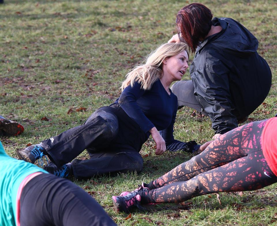  Muddy hell . . . Carol swaps her usual glam life for training